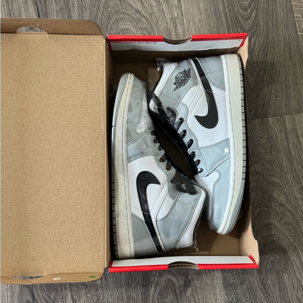 Jordan 1 mid in color way Light Smoke Grey